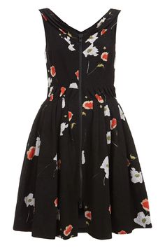 a black dress with red and white flowers on the front, zippered at the back