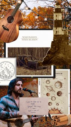 a man holding a guitar while standing in front of a lighthouse and trees with fall foliage