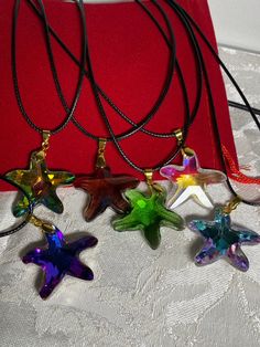 glass starfish pendant, necklace, star pendant necklace These colors go with any clothing pendant size: 3.2 cm / 1.25 inches approx. PU leather cord length: 44.5-49.5 cm / 17.5-19.5 inches These items are hand finished and can have miniscule imperfections comes with a gift bag designed for someone whom is looking for a unique necklace Giftable for Christmas, birthdays, Valentine's, any occasion Please have a look at the other items in my store. I ship all multi-item purchases in the same package Necklace Star, Starfish Pendant, Glass Stars, Art Deco Pendant, Star Pendant Necklace, Unique Necklace, Star Pendant, Unique Necklaces, Leather Cord