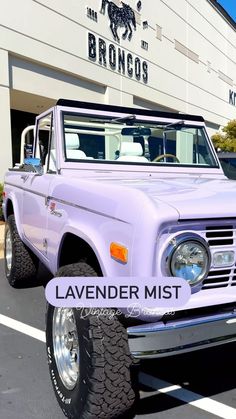 an old purple truck is parked in front of a bronco's building with the name lavender mist on it