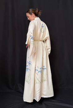 We Dating from the 1940's this elegant traditional cream silk kimono with hand painted iris. Perfect for a special occasion, wedding, or costume for film and television this is a unique and beautiful piece. Beautiful in its simplicity, the iris have been hand painted in soft blues with green foliage and what looks like decorative sprigs of lavender. It's a beautiful easy to wear robe which makes you feel elegant and can easily be dressed up or down. Fully lined in what feels like a man made fabric. Free size traditional kimono shape: Measurements taken with robe lying flat:  Across back: 63cm length sleeve: 35cm Cream Silk Kimono For Wedding, Vintage Spring Wedding Kimono, Pyjama Trend, Traditional Kimono, Painted Silk, Cream Silk, Hand Painted Silk, Silk Kimono, Green Foliage