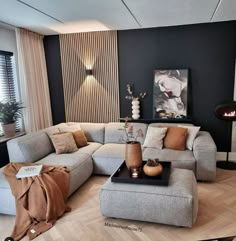 a living room filled with lots of furniture next to a fire place in the corner