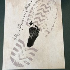 a piece of paper with a hand and foot print on it