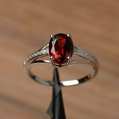 Silver Oval Garnet Birthstone Ring, Oval Garnet Ring In Silver, Oval Silver Garnet Birthstone Ring, Oval Garnet Birthstone Ring In Silver, Oval Garnet White Gold Jewelry, Elegant Oval Garnet Birthstone Ring, Oval Silver Ruby Promise Ring, Silver Oval Ring With Lab-created Ruby, Silver Oval Lab-created Ruby Ring