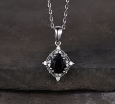 This beautiful Art Deco Black Onyx Necklace features 1.5 carat pear shaped center stone surrounded by Moissanite. For those who are looking for agate jewelry which is handcrafted in details, this unique black onyx necklace would be a perfect choice for you. Whether it be a Birthday gift for her, an anniversary gift her, or a celebration of yourself, this agate jewelry is the perfect gift from the heart. Matching Ring Set: https://www.etsy.com/listing/1439100319/vintage-black-onyx-engagement-ring Black And Silver Necklace, Subtle Goth, Goth Attire, Black Jewelry Necklace, Black Heart Necklace, Matching Ring Set, Black Onyx Engagement Ring, Necklace Art Deco, Onyx Engagement Ring