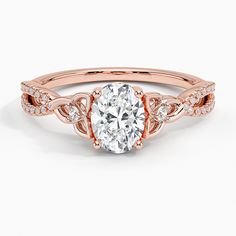 a rose gold engagement ring with an oval cut diamond