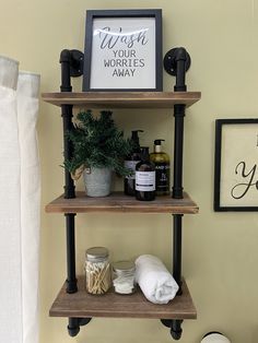 a bathroom shelf with two shelves on each side