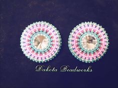 Beautiful baby blue with a starburst of pinks and reds.... 2" round.... fingernail posts.... backed with buckskin Flat Earrings, Beadwork Ideas, Native Earrings, Beaded Lanyard