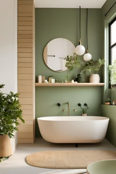 Step into tranquility with this Japandi bathroom retreat. The soft green walls, minimalist fixtures, and natural decor elements create a soothing and elegant space. The freestanding tub and lush plants add a touch of nature, perfect for unwinding. #JapandiBathroom #TranquilRetreat #GreenDecor #MinimalistDesign Soothing Bathroom Ideas, Peach Green Bathroom, Spa Vibes Bathroom, Japandi Interior Design Bathroom, Green Washroom, Small Green Bathroom Ideas, Green And Wood Bathroom, Calming Bathroom Ideas, Bathroom Sage Green