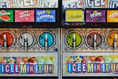 an old fashioned vending machine with ice cream and gummy on the front side