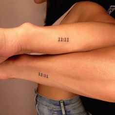 two women with tattoos on their legs and the words 11 11 written in black ink