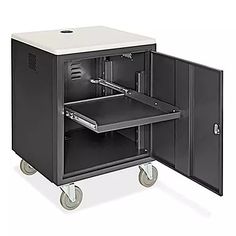 a black metal cabinet with wheels and a drawer on the front, open to show its contents