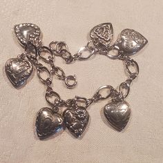 Beautiful Vintage Sterling Puffy Heart Charm Bracelet with 7 fantastic charms. These bracelets are super cute and collectable.  I've pictured it on my wrist which is 6 and 3/4 inches around but the Bracelet is adjustable.  Please look closely so you can see all the charms!! Cute Charm Bracelets, Bracelet Cute, Grunge Jewelry, Puffy Heart Charms, Vintage Silver Jewelry, Dope Jewelry, Silver Charm Bracelet, Puffy Heart, Jewelry Lookbook