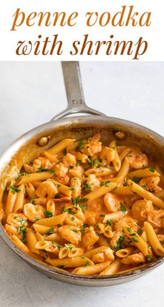 a skillet filled with pasta and shrimp