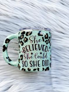 a leopard print coffee mug with the words she believed she could so she did on it