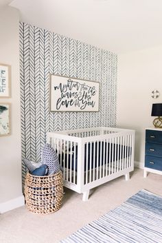 a baby's room with blue and white decor