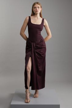 Fall '24: Allow Our Latest Collection Of Autumn Pieces To Inspire You For The Season Ahead. Experience Elevated Occasion Looks In Our Maxi Dress, Which Features A Universally Flattering Fit And Flare Silhouette, A Squared Neckline, And A Statement Draped Design. The Thigh High Leg Split Makes A Statement, While The Draped Design Brings Dimension To The Piece. Style This Skirt With Anything, Like Block Heels Or Sandals For An Eye Catching Occasion Look. Tailored Satin Waist Drape Corset Maxi Dres Ruched Draped Corset Evening Dress, Asymmetrical Satin Draped Dress, Draped Evening Corset Dress, Chic Draped Satin Finish Maxi Dress, Fitted Draped Viscose Maxi Dress, Petite Wedding Guest Dresses, Latest Maxi Dresses, Outfits Petite, Winter Wedding Guest Dress