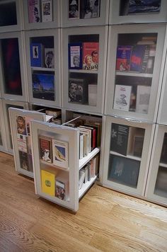 there is a book case with many books in it