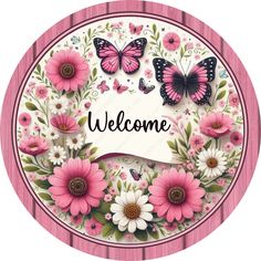 a welcome sign with pink flowers and butterflies on the front, surrounded by white daisies