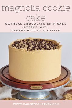 a cake sitting on top of a wooden stand with chocolate chips in the middle and text overlay