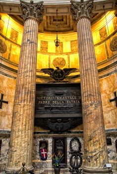 the inside of a building with two large pillars