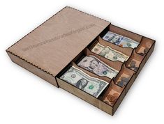 an open wooden box filled with lots of money