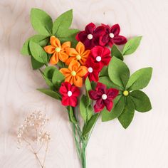 a bunch of flowers sitting on top of a table