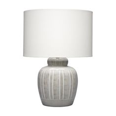 a lamp with a white shade on it