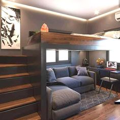 a loft bed with a couch underneath it