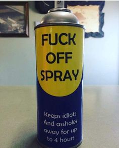 black and white photograph of a can of spray paint with the words, f k off spray