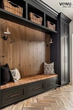 a wooden bench with baskets on top of it in front of a bookcase and bookshelf