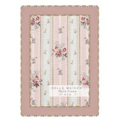 a pink and white striped wallpaper with roses on the border, in an ornate frame