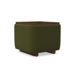 a green ottoman that is sitting on top of a white surface and brown wood legs