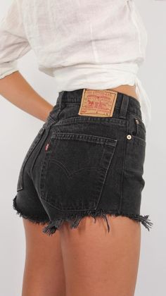 Vintage 90s Black Levis High Waist Cut Off Denim Shorts | 11 Sizes | 23” 24" 25" 26" 27" 28" 29" 30" 31" 32" 33"Vintage denim shorts, vintage Levis, Levis shorts, high waist shorts, high rise, cut off shorts, short shorts, 90s shorts, sustainable cloth// Made to be fitted around the waist, hips + bum - then slightly looser on the thighs// High waist, high rise// Longer inseam and longer around the bum - but slightly higher on the thigh to make your legs look longer// High quality, medium/heavy w Denim Shorts Outfit, 90s Shorts, Vintage Denim Shorts, Black Levis, Jeans Levis, Cute Everyday Outfits, Cute Shorts, Looks Style, Preppy Outfits