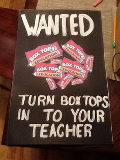 a sign that reads, wanted turn boxes in to your teacher with candy on it