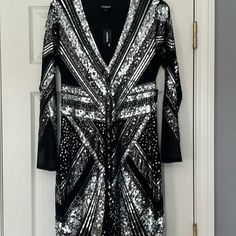 Fun Stylish Sequin Dress From Express!! Never Worn. Some Stretch. Classy Mess Areas. Great Length. Long Sleeves. Deep V Neck In The Front. Send Offers Questions? Leave A Comment Below! Great Lengths, Express Dresses, Deep V Neck, Sequin Dress, Deep V, Black Silver, Sequin, Long Sleeve Dress, Long Sleeves