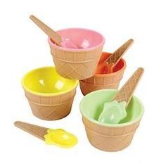 four ice cream cones with scoops and spoons in each one, on a white background