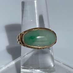 Crafted Of Yellow Gold And Jade, This Ring Seems To Be From The Edwardian Or Art Nouveau Period. It Has Vine-Like Scrolls And A Beautiful Bezel Set Cabochon. * 1 Piece Left Elegant Green Gemstones In 14k Gold, Antique Green Multi-stone Jewelry, Polished Yellow Gold Jade Jewelry, Yellow Gold Jade Jewelry With Cabochon, Art Deco Multi-stone Oval Jewelry, Art Deco Jade Jewelry For Formal Occasions, Exquisite Jade Jewelry For Formal Occasions, Elegant Yellow Gold Jade Rings, Formal Art Deco Jade Jewelry