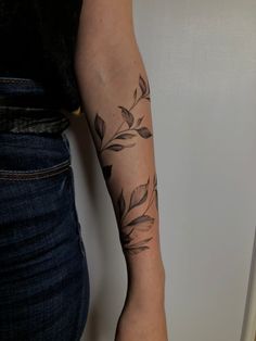 a woman with a tattoo on her arm