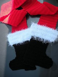 a pair of red and white knitted gloves