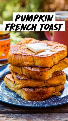 pumpkin french toast stacked on top of each other with butter and syrup in the background