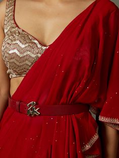 Editor's Note Elevate your traditional style with our red ruby embroidered draped sari, paired with a stitched blouse. This ensemble is perfect for special occasions, allowing you to showcase timeless elegance with intricate embroidery and the convenience of a pre-stitched blouse. Make a lasting impression at any event with this classic and sophisticated attire that combines tradition with modern comfort. Fabric: Sari: viscose georgette blouse net with sequence Color: Red Components: Sari and bl Mukaish Saree, Mukaish Work, Red Sari, Red Drapes, Ritu Kumar, Ruffle Saree, Drape Saree, Georgette Blouse, Sari Blouse