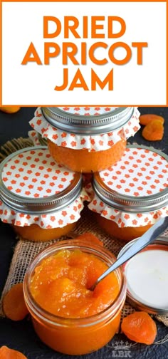 an orange jar filled with apricot jam on top of a cloth covered table