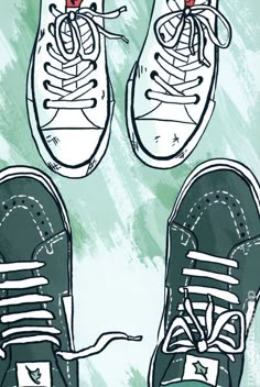 two pairs of tennis shoes sitting on top of each other with the same shoelace