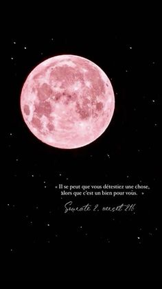 a pink moon in the night sky with a quote on it