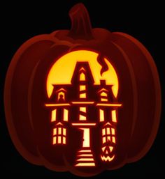 a carved pumpkin with an image of a castle on it