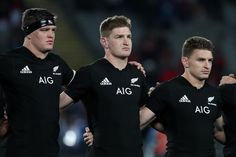 the all blacks players are standing together