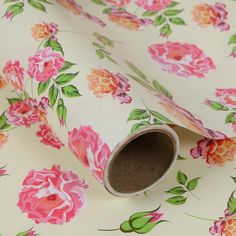 a floral wallpaper with pink and orange flowers on white background, rolled up in half