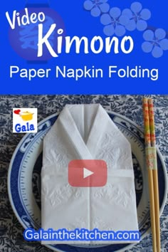 paper napkin folding with chopsticks on the side and video kimono in the middle