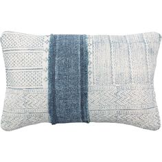 a blue and white pillow on a white background